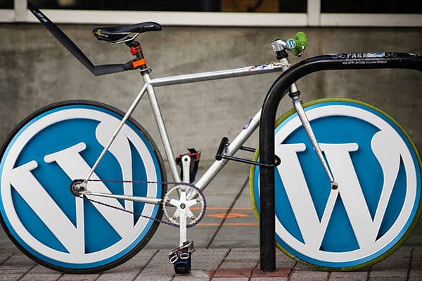 image of bicycle with Wordpress logo on tires